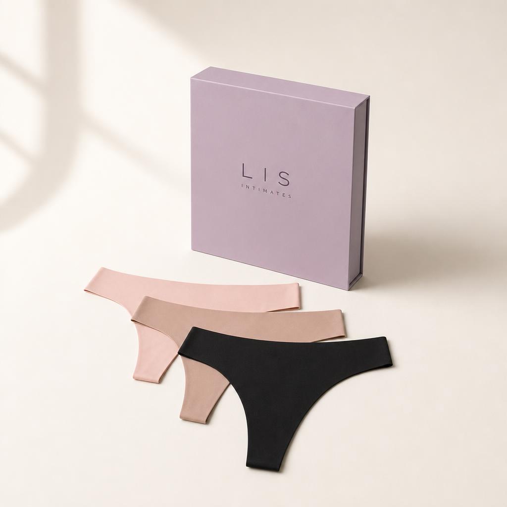 Three seamless thongs fanned beside the Valis Intimates box